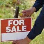 male hands hammer sign for sale