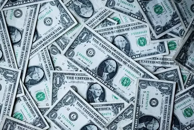 A pile of dollar bills, representing reasons the highest offer isn’t always the best one