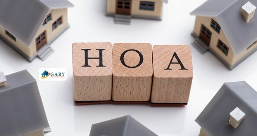 A HOA word surrounded by miniature houses. 