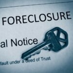 A key on top of a foreclosure notice