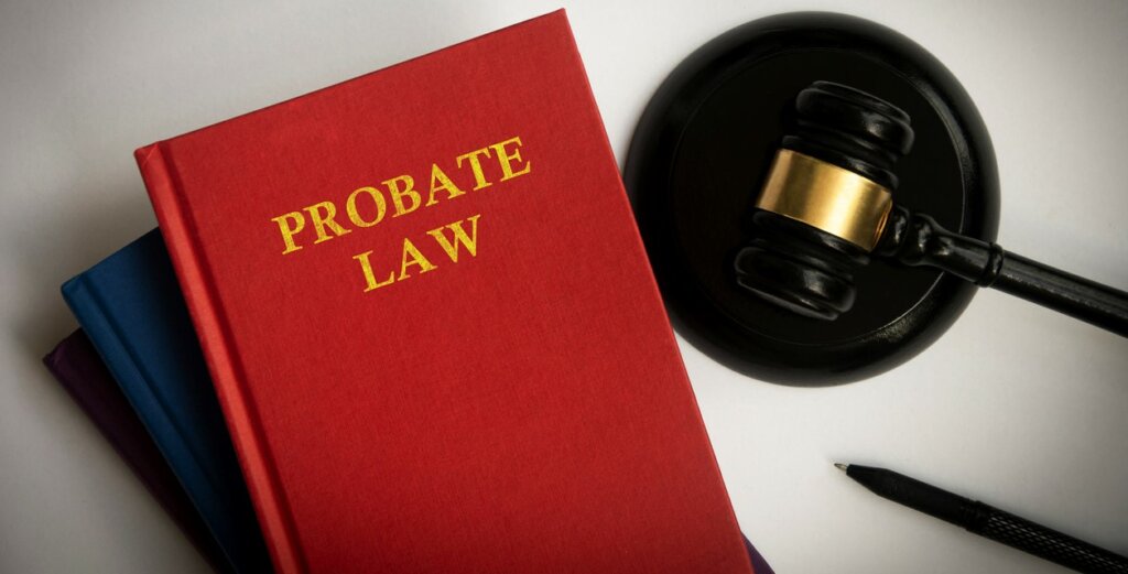 Top view of probate law book with gavel on white background. Law concept.