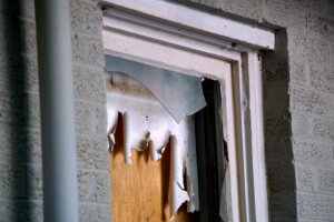 A broken window in Newark, NJ. With Templar Real Estate Enterprises, you can sell your rental property without making repairs!