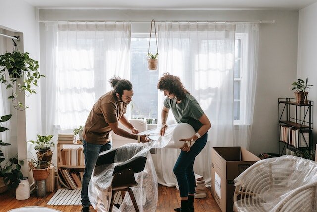 A woman helping a loved one empty his inherited house.