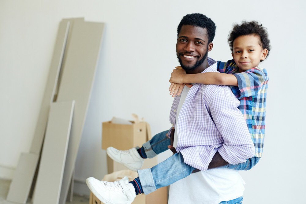 son piggy back riding dad inside house