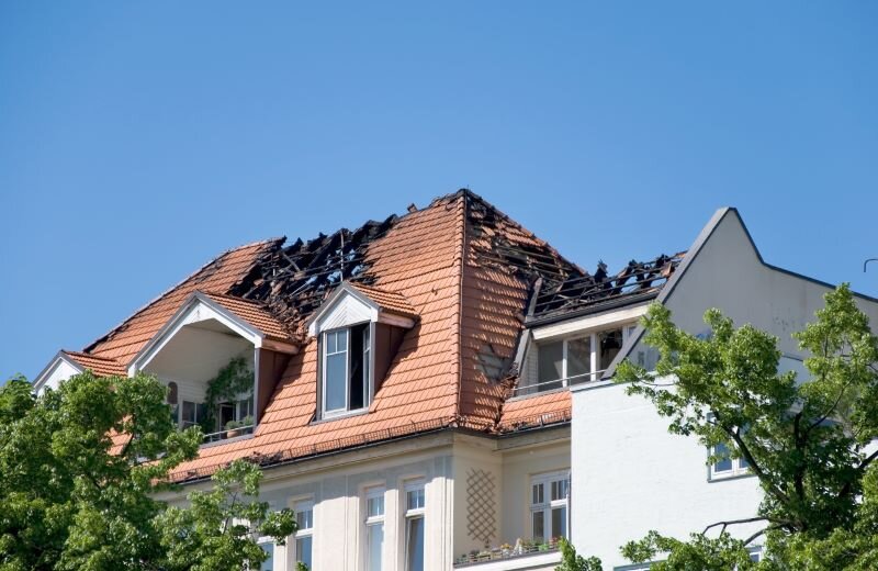 A house is badly damaged after a fire.