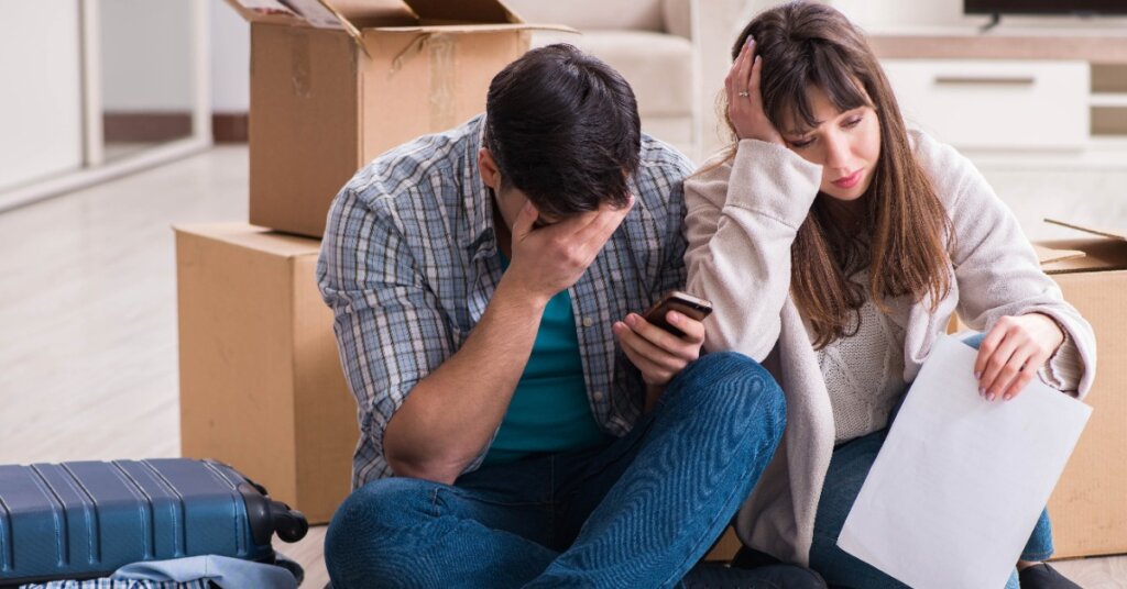 Young couple receiving foreclosure notice letter AdobeStock_373472144