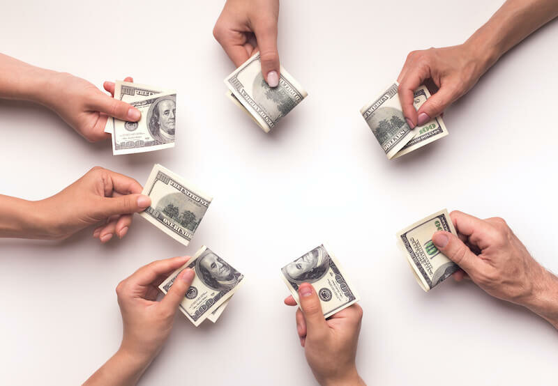 siblings hands with money on each one