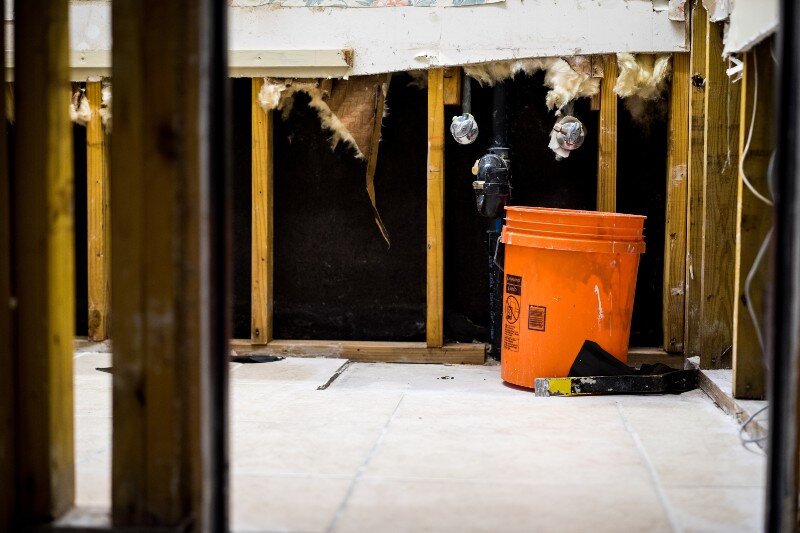 Broken pipes are being repaired in a house in Oshkosh, WI.