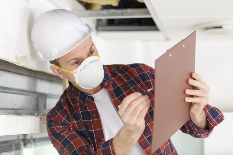 A home inspector goes through a checklist in a home inspection in Philadelphia, PA.