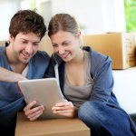 two people on the couch deciding how to sell their house in Charlotte NC