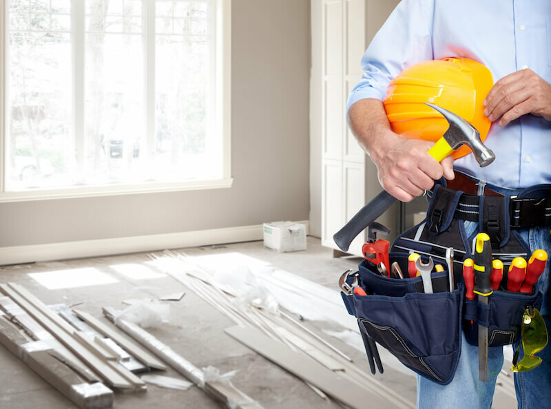 Handyman with a tool belt. House renovation service