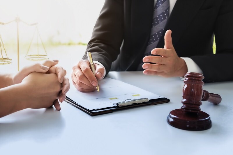 A landlord receiving some advice from a lawyer about removing squatters.