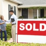 Agent closing the house deal to couple