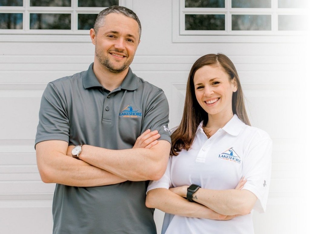 Ryan and Danielle arms folded with Lakeshore Home Buyer shirt