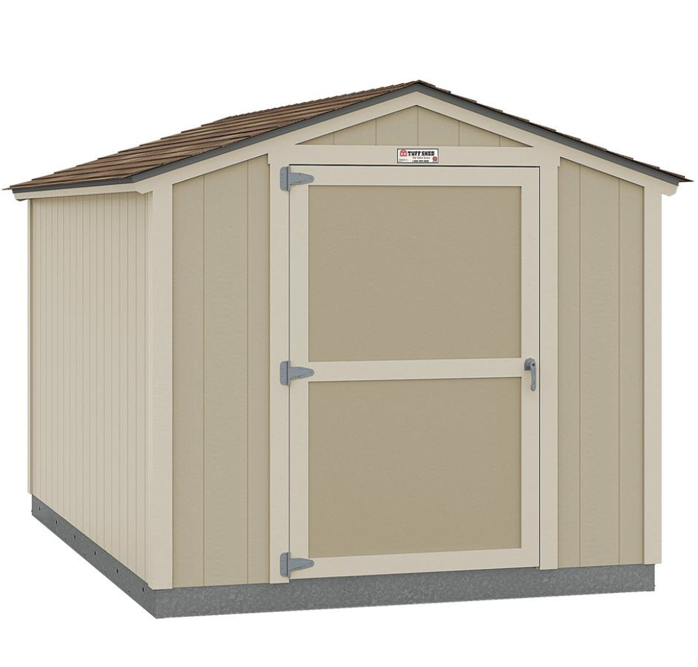 A cream colored shed with a brown shingle roof with a logo above the door with the text "Tuff Shed"