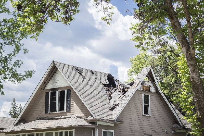 A fire-damaged home in Minnesota is listed for sale.