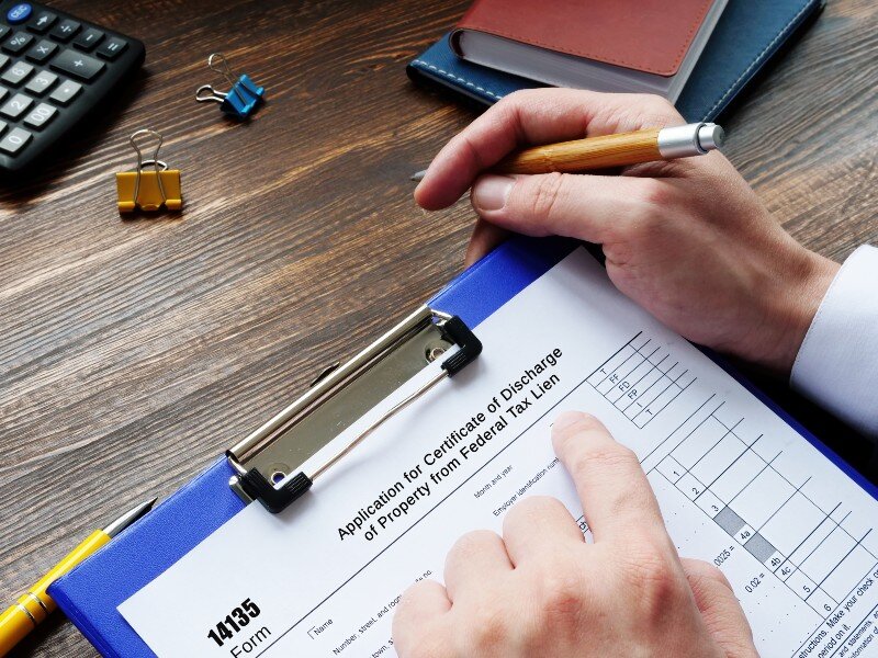 A homeowner going through a tax lien checklist.