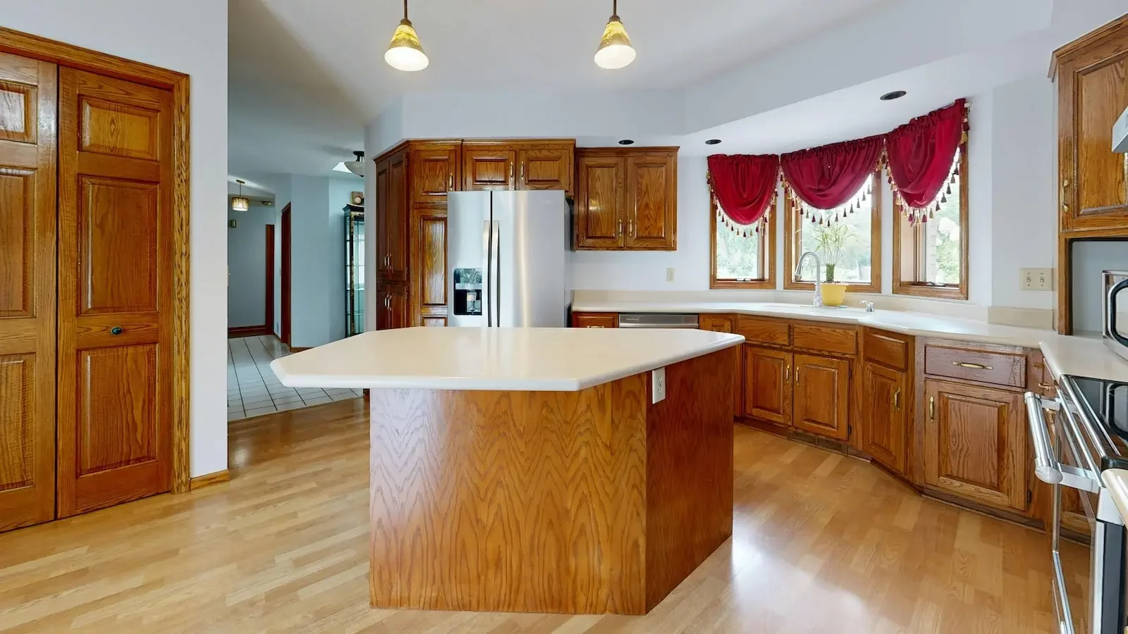 home with wood kitchen cabinets and island