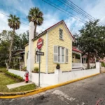 yellow Florida home on corner lot