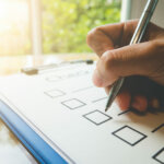 hand on a checklist