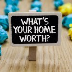 sign that says whats your home worth for a quick home sale
