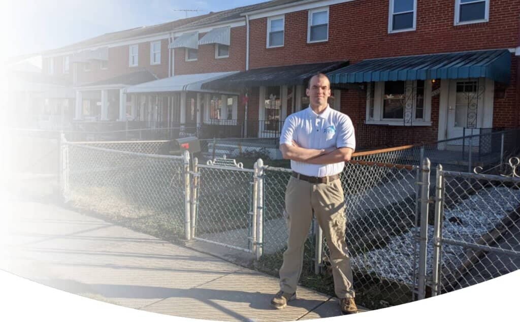 212 Homes, LLC owner standing in front of White Marsh row homes.