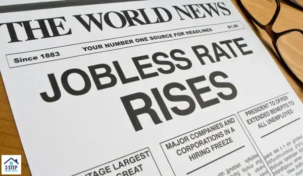 newspaper with 'Jobless Rate Rises' headline