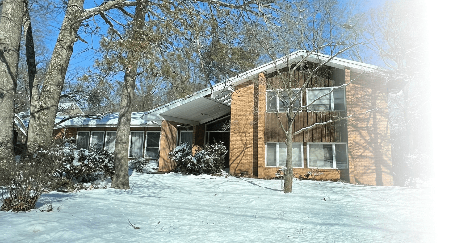 Our Severna Park Brady Bunch house exterior before we painted it white and added black accents