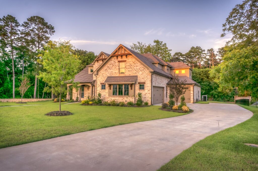 beige bungalow house surrounded by trees