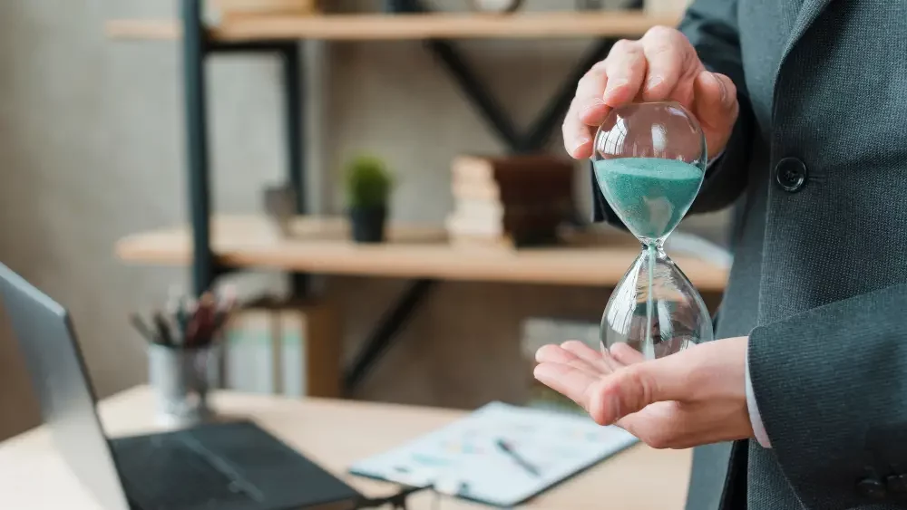 a man holding a hourglass