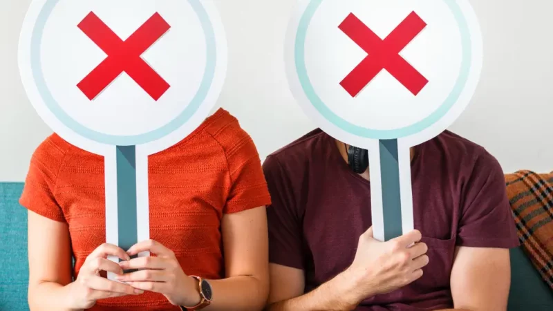 Man and woman with X as faces