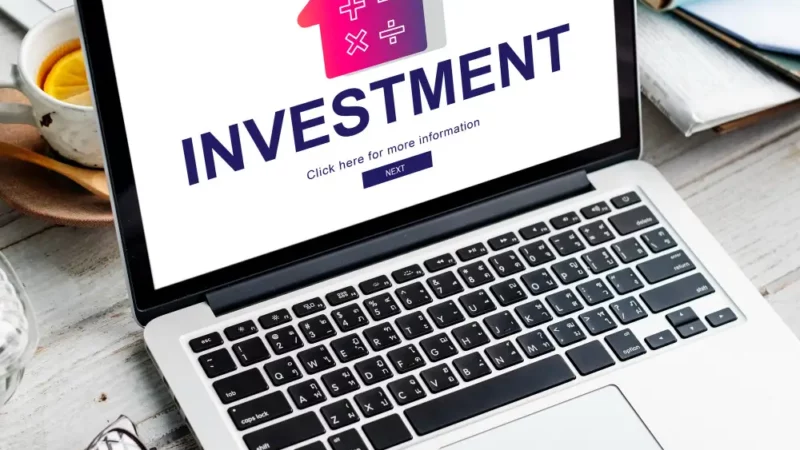 Laptop with the word investment on it.