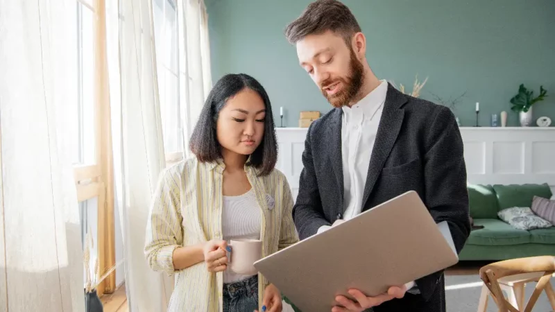 a man in a suit and an asian woman