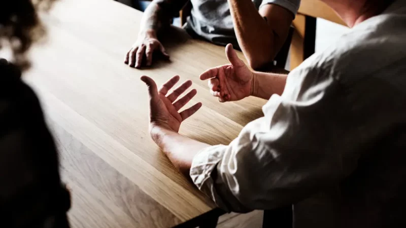 A group of men having a conversation
