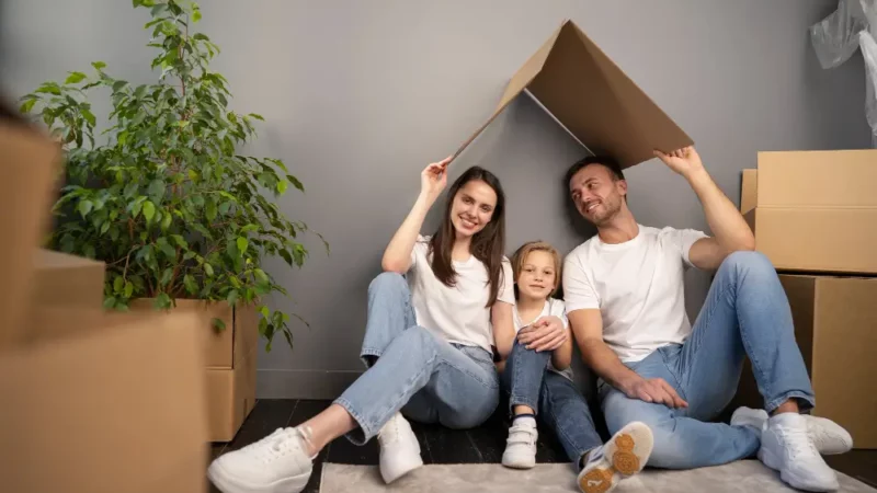 Family under a cardboard roof