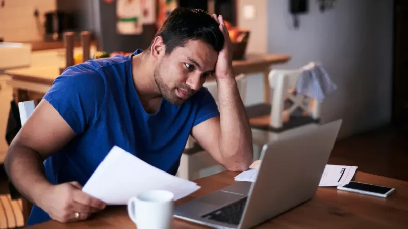 Man having a problem in front of laptop