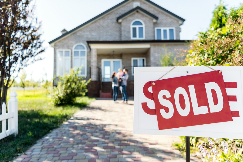 A house with a sold sign with a lien against it in Texas