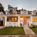 coral painted front door renovation on charleston house