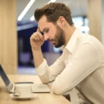 man thinking about what to do after inheriting her family home