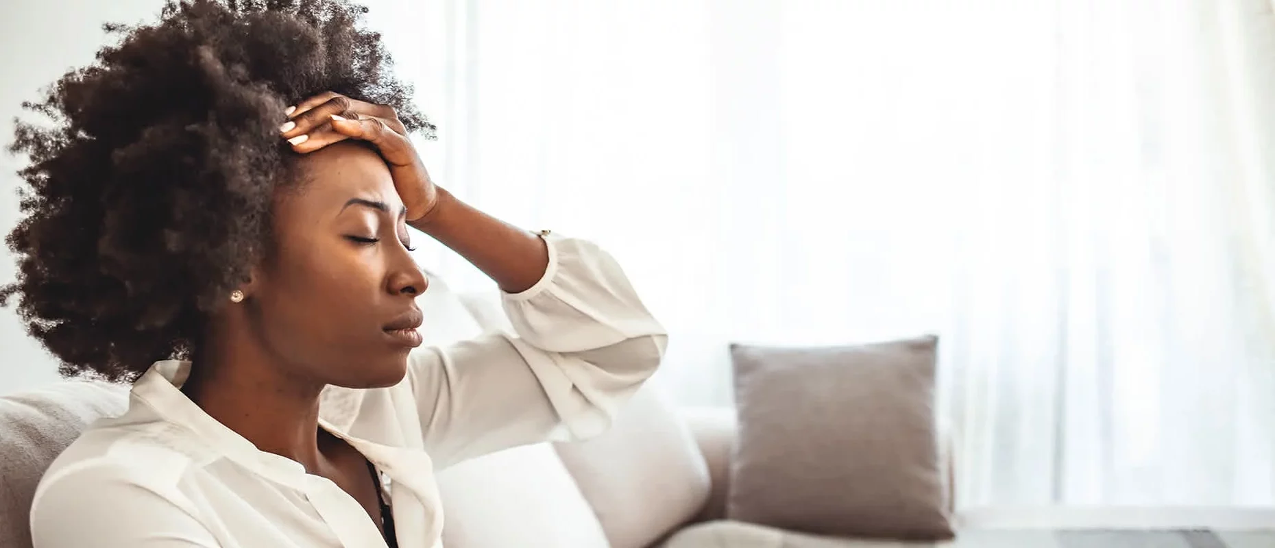 Stressed South Carolina woman reviewing an inherited property from her parents, symbolizing the challenges of selling an inherited house during probate.