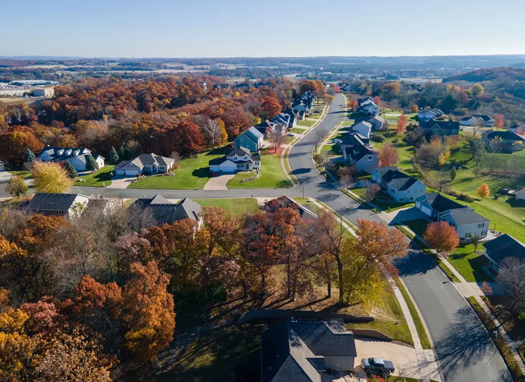 Aerial view of suburban homes and tree-lined streets, perfect for selling a rental property in New Berlin