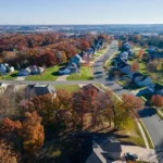 Aerial view of suburban homes and tree-lined streets, perfect for selling a rental property in New Berlin