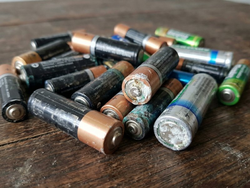 Pile of used AA and AAA alkaline batteries ready for disposal in Buffalo NY — can go in regular trash in New York State but free recycling available at Batteries Plus Amherst