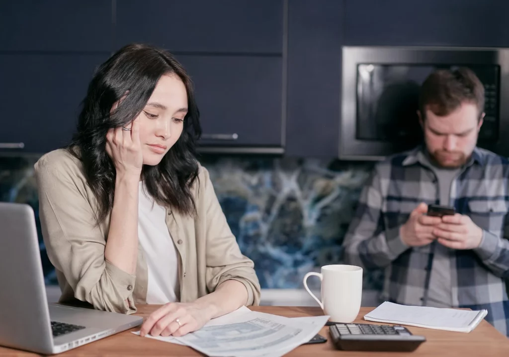 Woman looking at mortgage note documentation