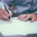 Man writing a contract